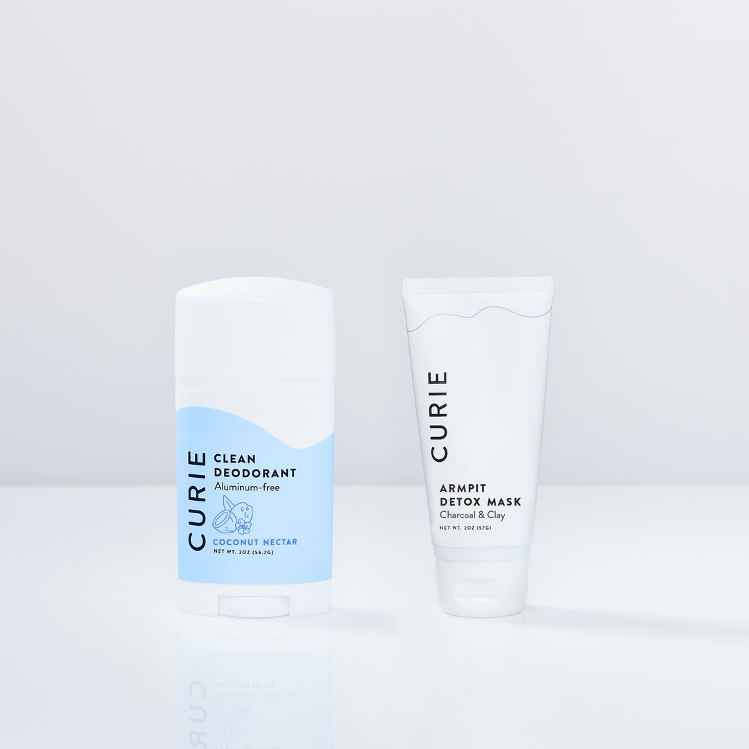 Two Curie products: a clean deodorant and an armpit detox mask, displayed on a white surface.
