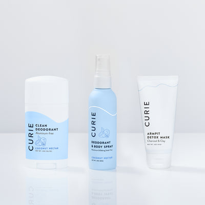 Three CURIE brand personal care products on a white background.